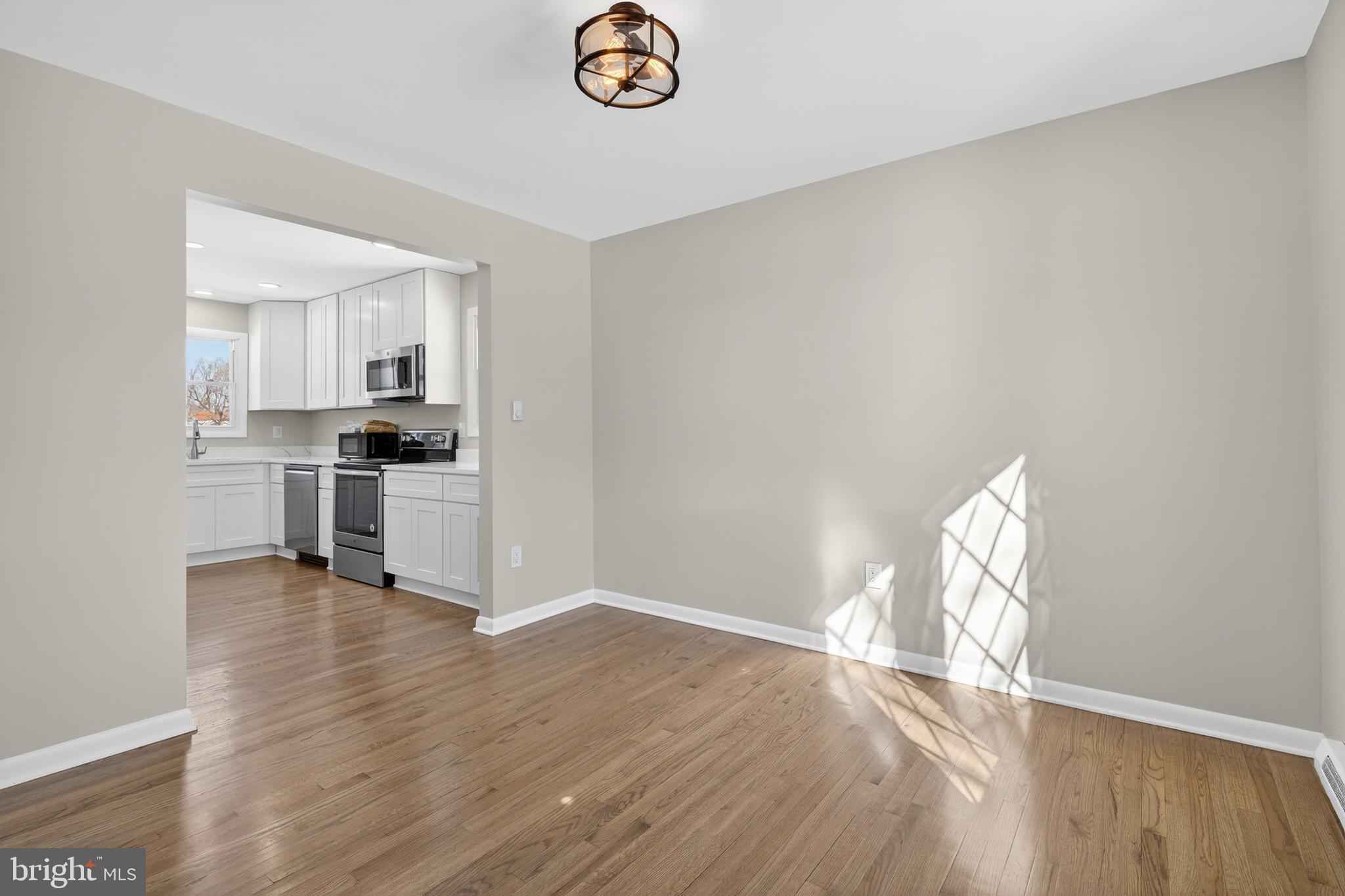 222 Chelsea Road Pasadena, MD 21122 - Photo 13 of 38 Dining Room. Off of Kitchen. Real oak floors.