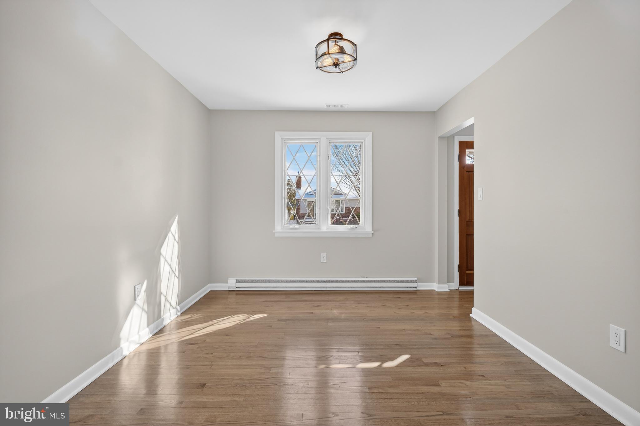 222 Chelsea Road Pasadena, MD 21122 - Photo 15 of 47 Dining Room. Off of Kitchen. Real oak floors.
