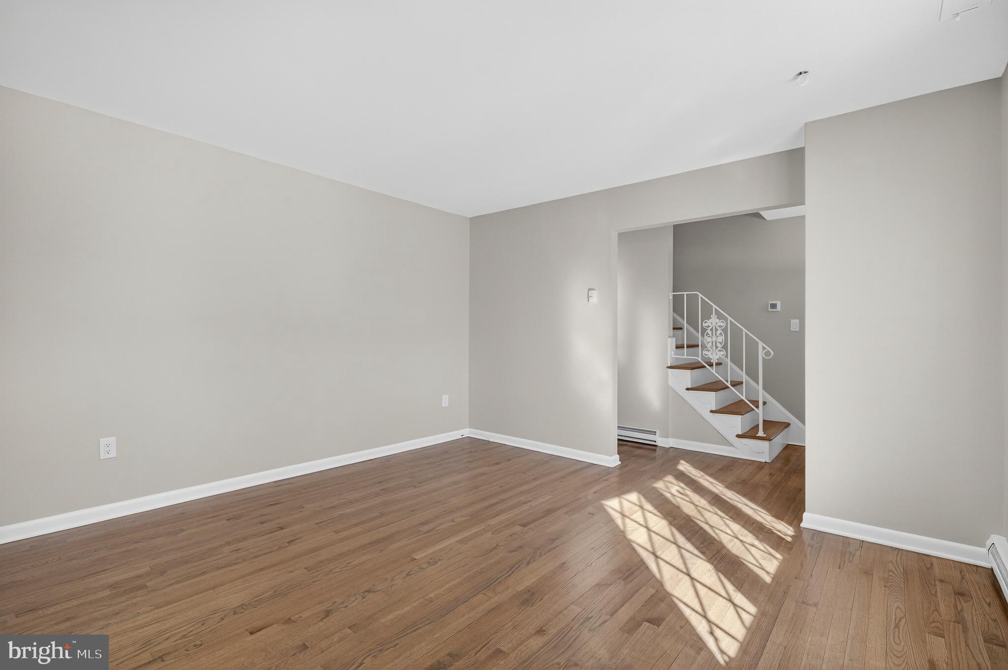 222 Chelsea Road Pasadena, MD 21122 - Photo 18 of 47 Large Living Room. Solid oak stairs to upstairs