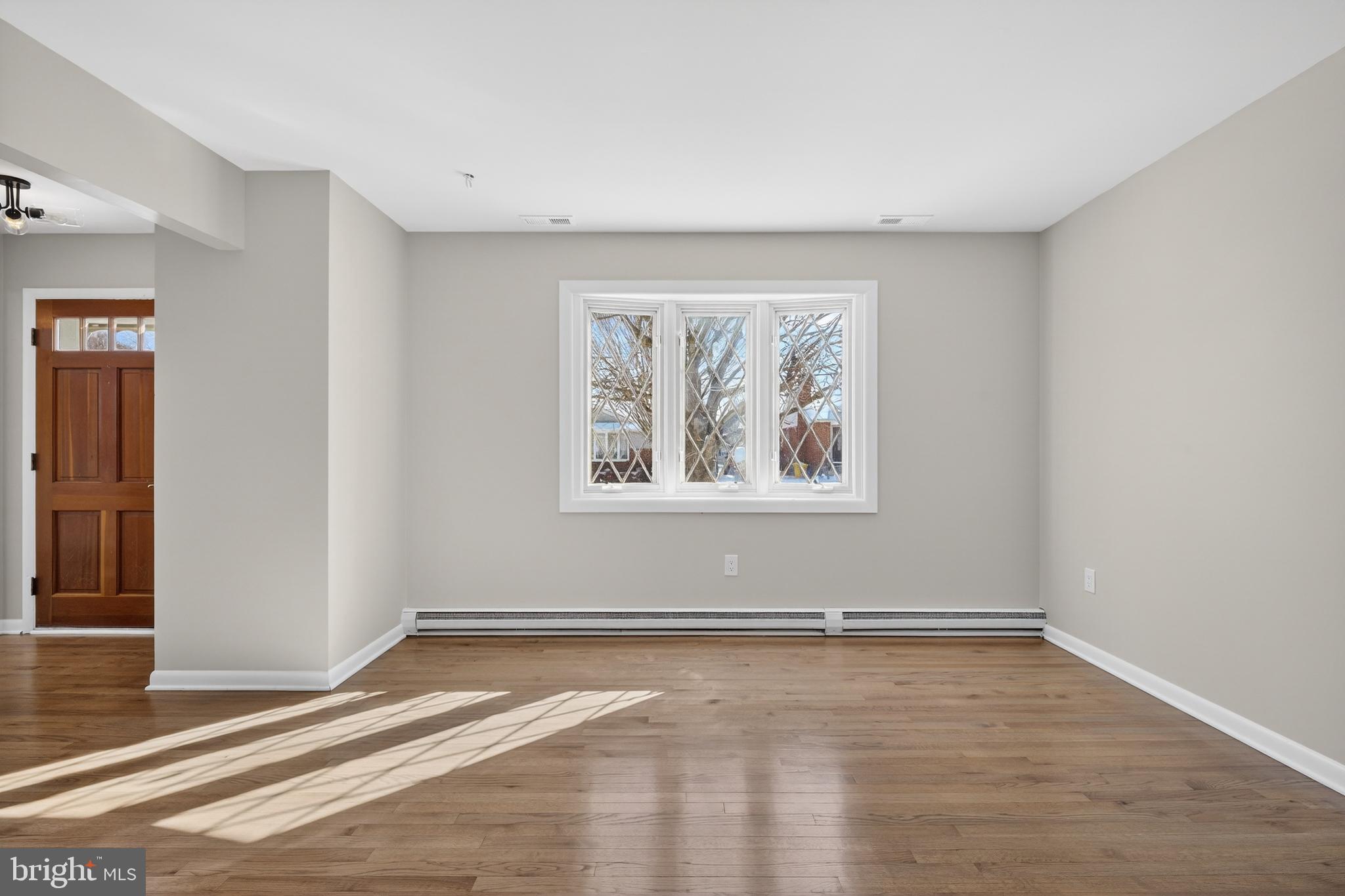 222 Chelsea Road Pasadena, MD 21122 - Photo 18 of 38 Living Room. Whole interior home repainted.