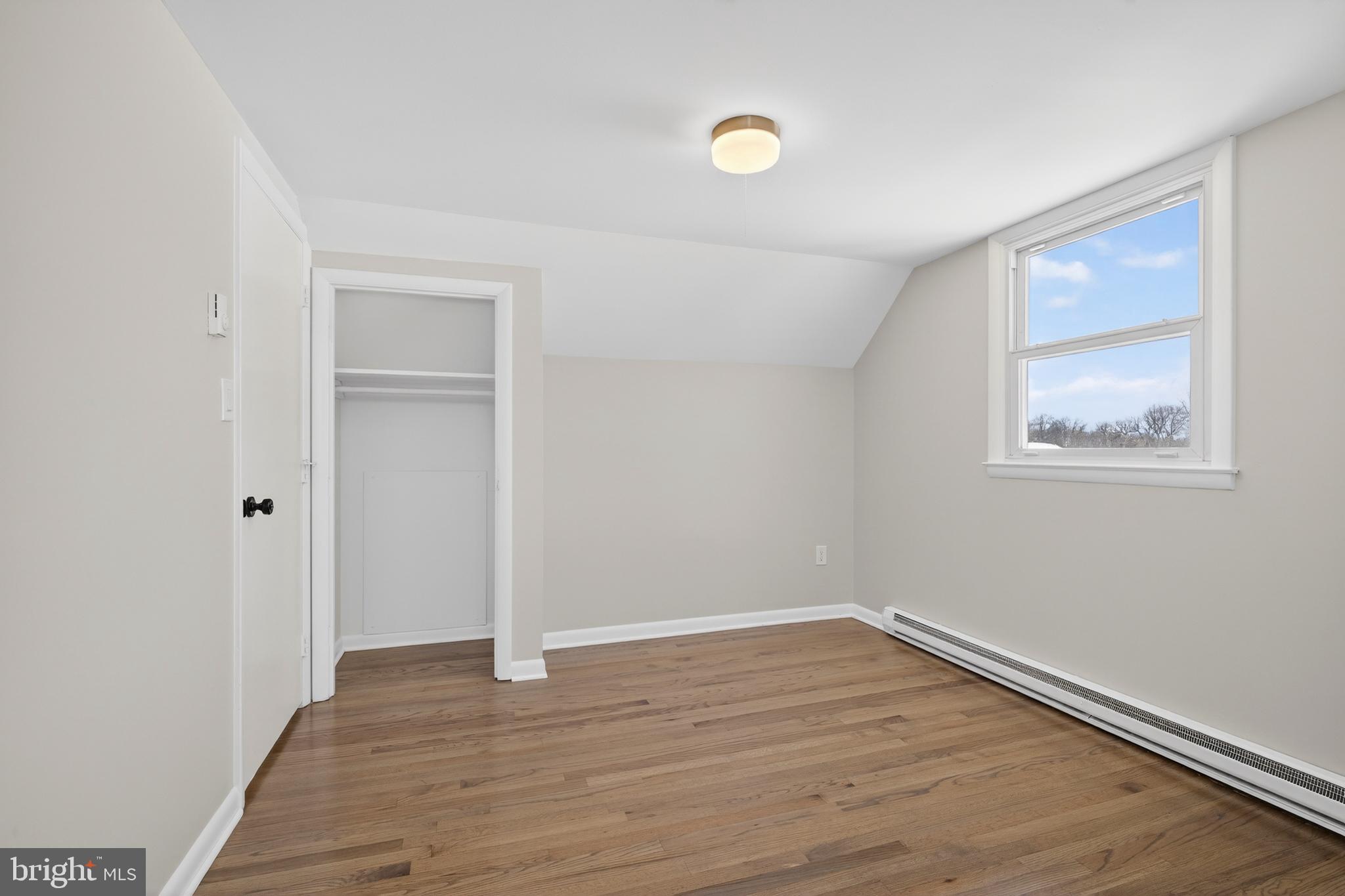 222 Chelsea Road Pasadena, MD 21122 - Photo 23 of 47 Upstairs. Bed #2. Oak floors, vaulted ceiling.