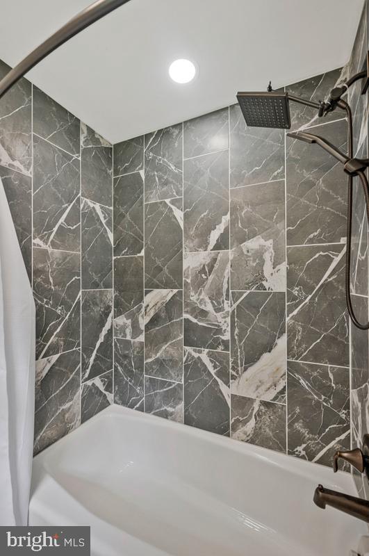 7185 Hawthorne Road La Plata, MD 20646 - Photo 32 of 59 Sleek marble shower retreat.