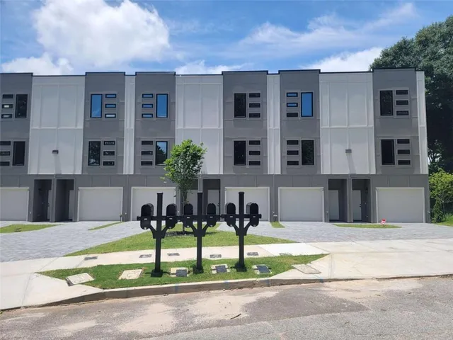 a front view of building with yard