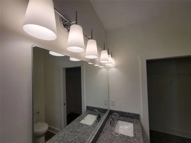 a room with a mirror and a fan