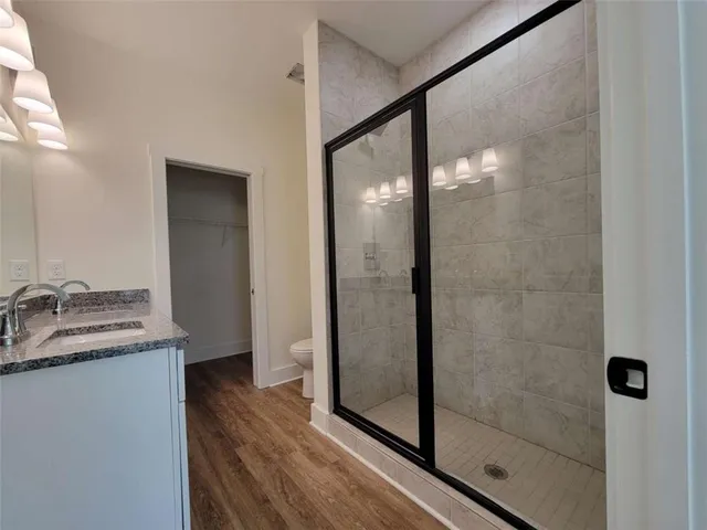 a bathroom with a shower and a sink