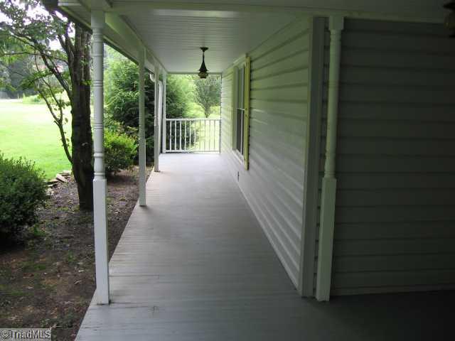 202 Rink Road Winston-Salem, NC 27107 - Photo 8 of 12 Exterior Front. Rocking Chair Front Porch