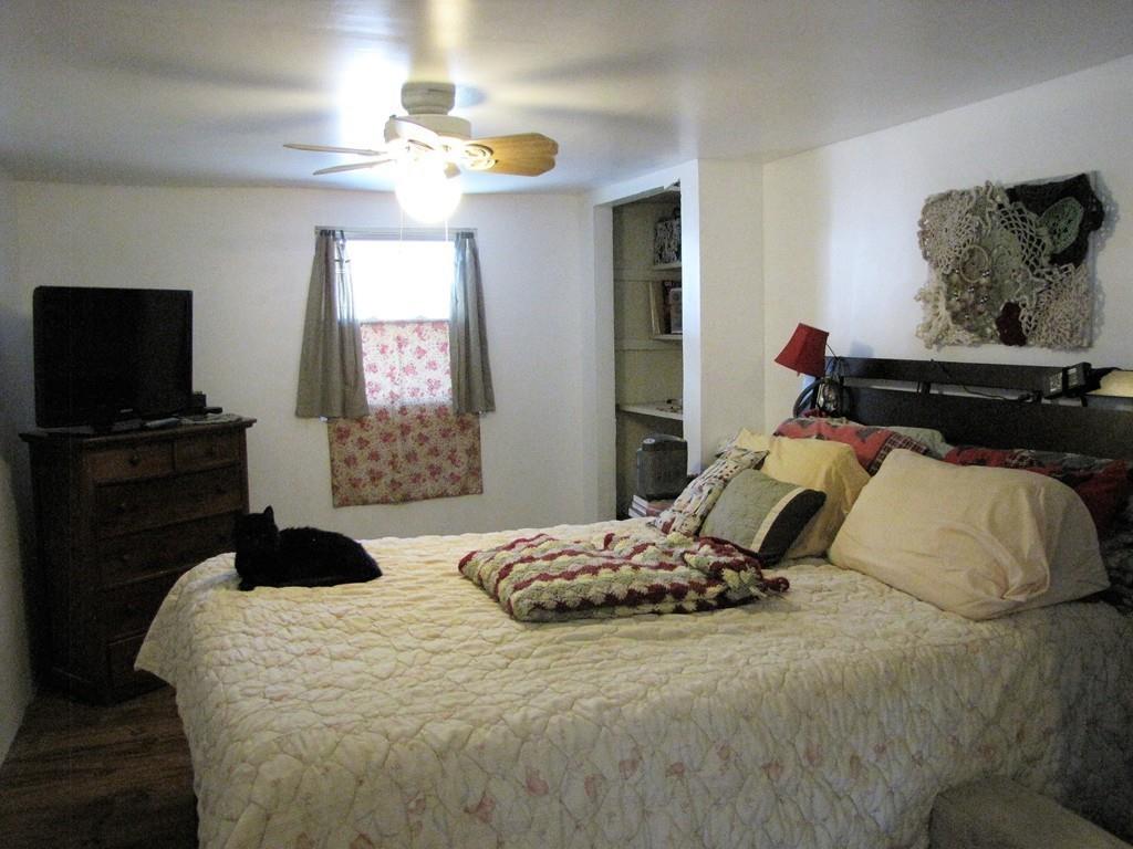 1400 Brimfield Road Warren, MA 01010 - Photo 9 of 17 a bedroom with a bed and a flat screen tv