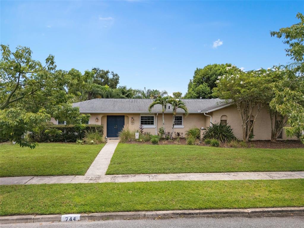 744 Cornwall Road Winter Park, FL 32792 - Photo 27 of 57 a front view of a house with a yard