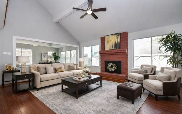 a living room with furniture and a fireplace