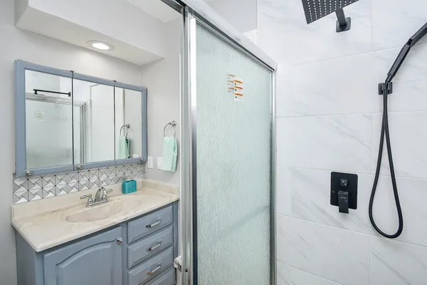a bathroom with a sink and a mirror