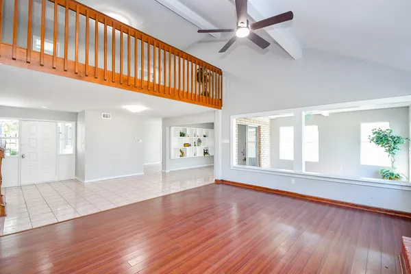 a view of livingroom with hardwood floor and ceiling fan
