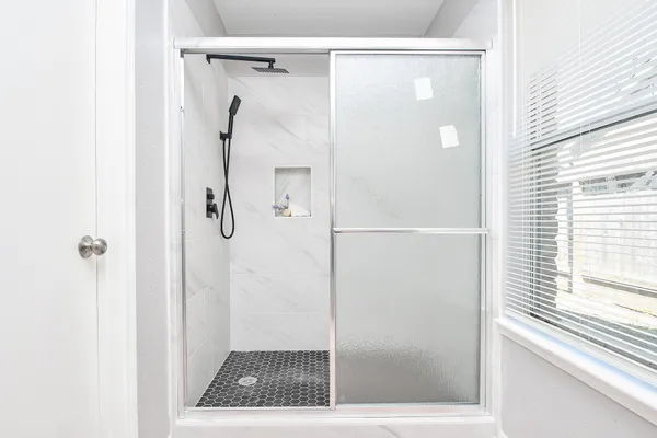 a view of a room with wooden floor and cabinet