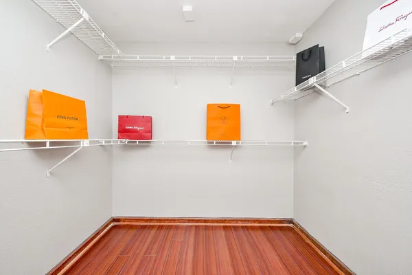 front view of a house with a yard and an trees