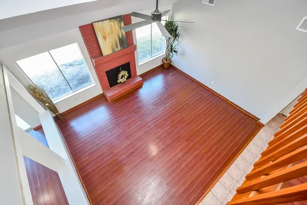 a view of an entryway with wooden floor