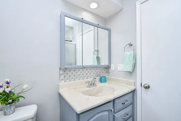 a bathroom with a sink and a mirror