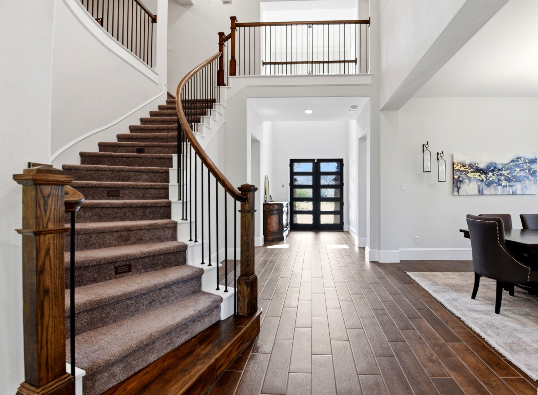 10062 South Goshawk Trail Conroe, TX 77385 - Photo 6 of 43 a view of entryway and hall with wooden floor