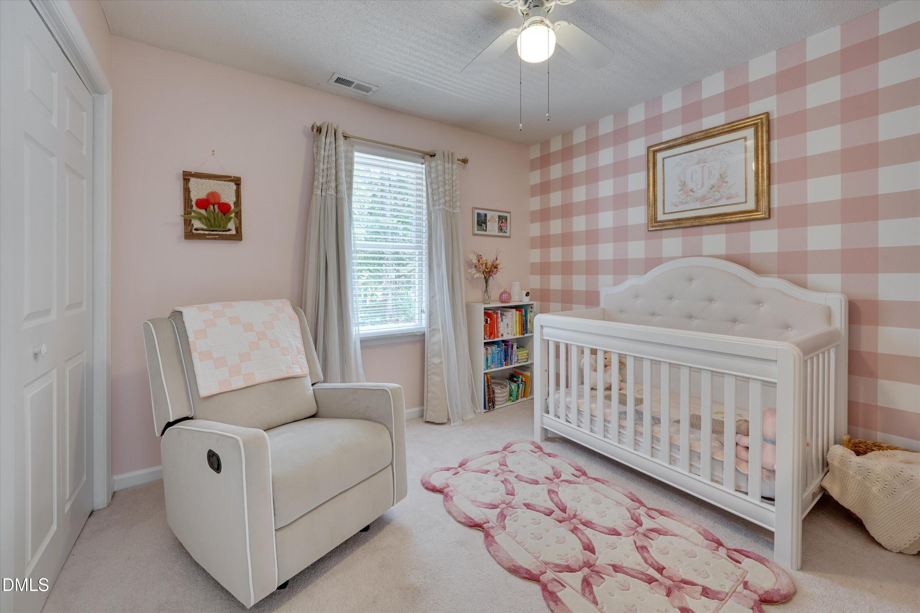 3301 Lassiter Street Durham, NC 27707 - Photo 22 of 32 a bedroom with furniture and a window