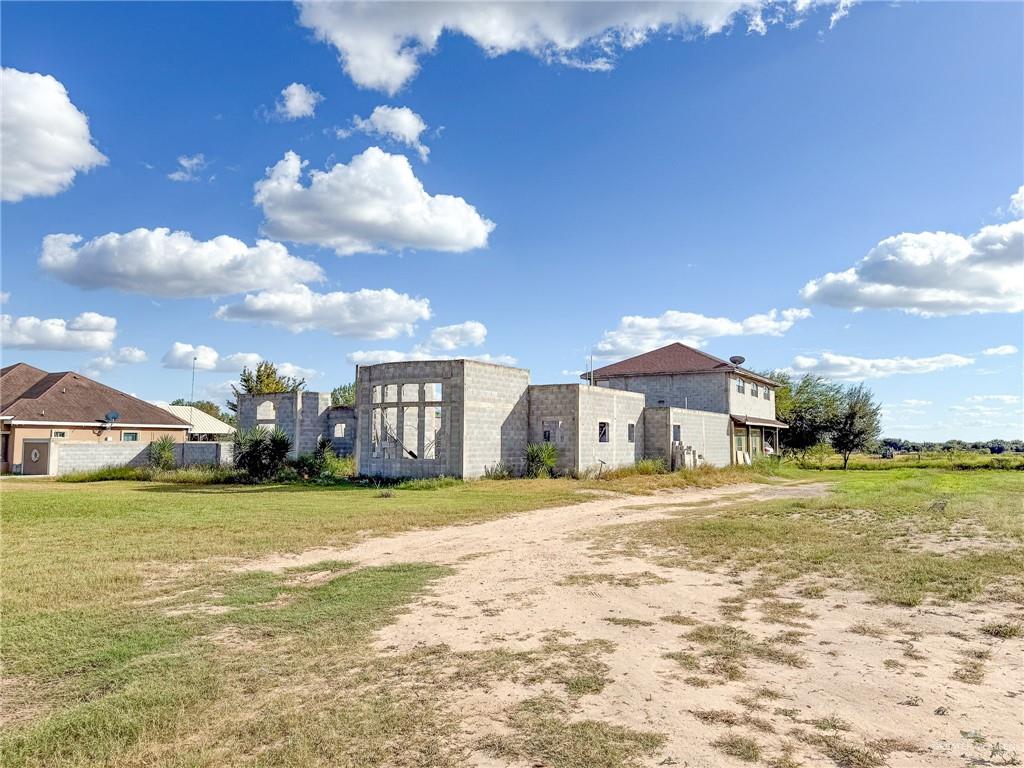 76 Marissa Street Rio Grande City, TX 78582 - Photo 1 of 10 a view of a big room with a big yard and large trees