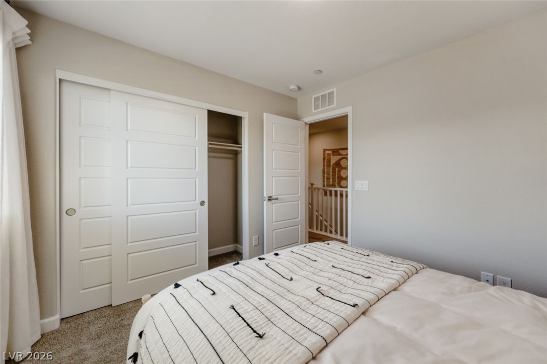 911 Cadence View Way Henderson, NV 89011 - Photo 12 of 28 This cozy room offers convenient storage and easy access to the home's upper level.