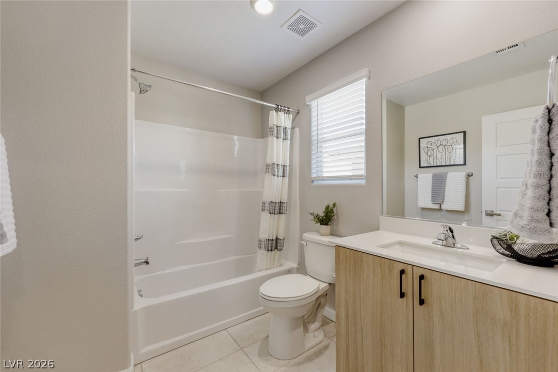 911 Cadence View Way Henderson, NV 89011 - Photo 13 of 28 This modern bathroom features clean lines and a functional design, providing a refreshing daily retreat.