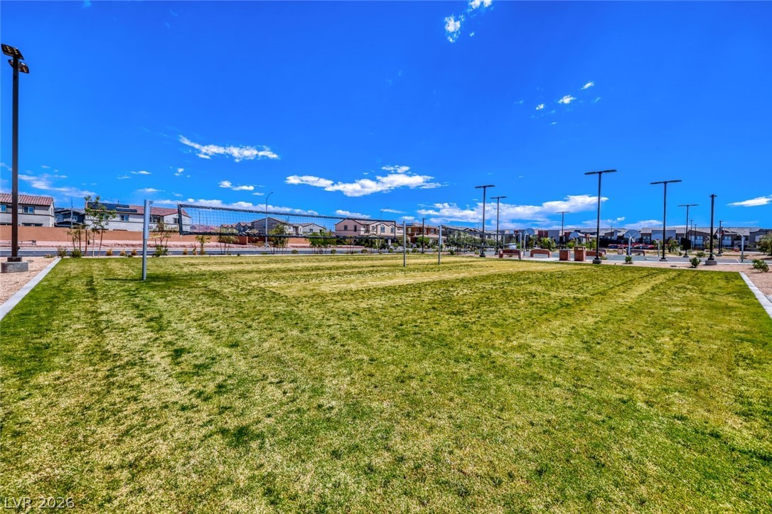 911 Cadence View Way Henderson, NV 89011 - Photo 25 of 28 This community park features a well-maintained lawn and a volleyball court for recreational activities.