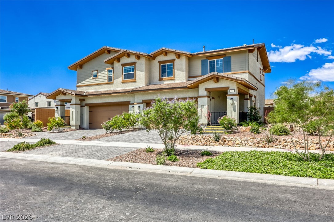 911 Cadence View Way Henderson, NV 89011 - Photo 26 of 28 This appealing two-story residence features a welcoming entrance and neatly landscaped surroundings.