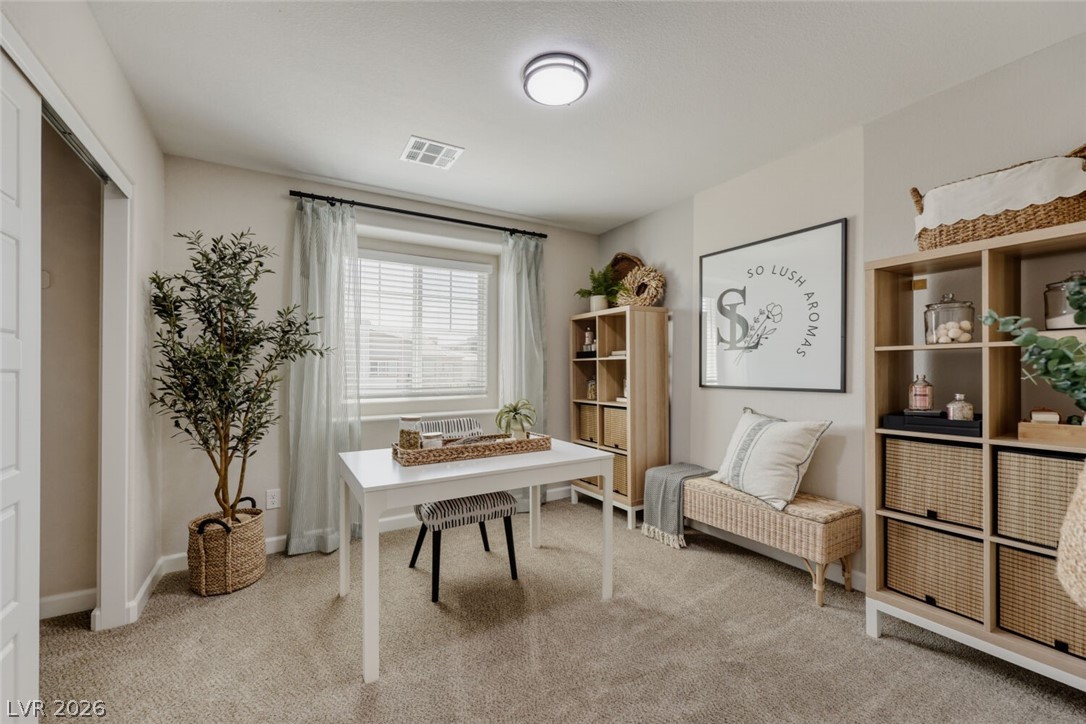 911 Cadence View Way Henderson, NV 89011 - Photo 9 of 28 This versatile room features ample natural light and offers a cozy, functional space.