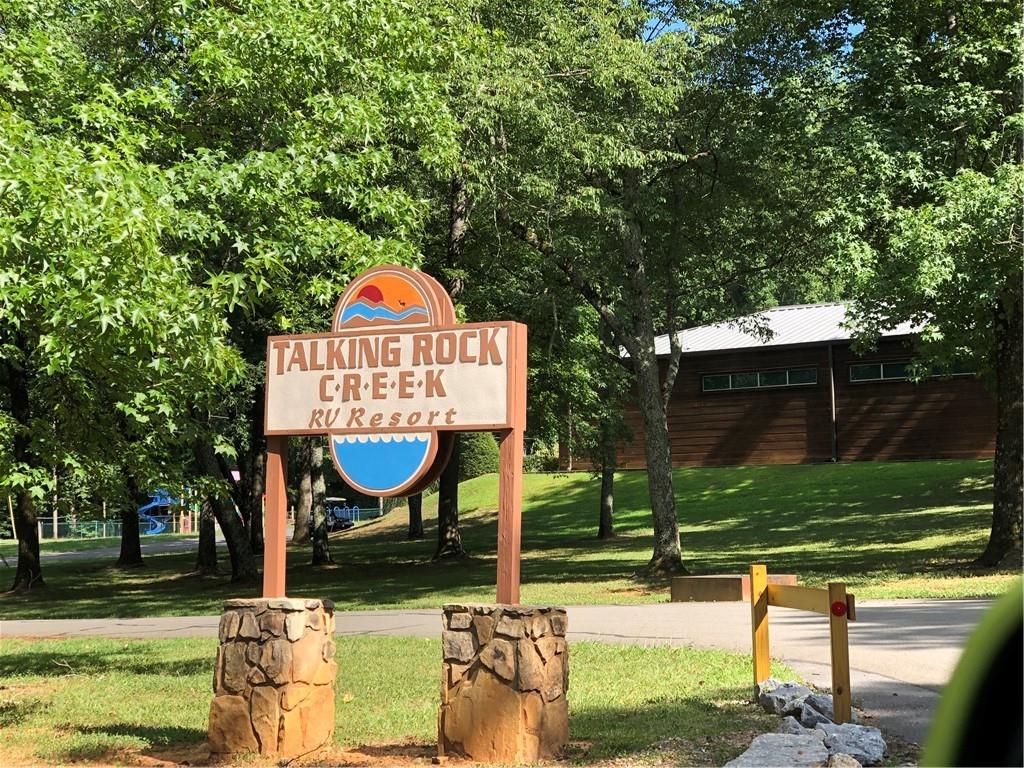 197 Stirratt Road Ranger, GA 30734 - Photo 21 of 22 a front view of a house with garden and trees