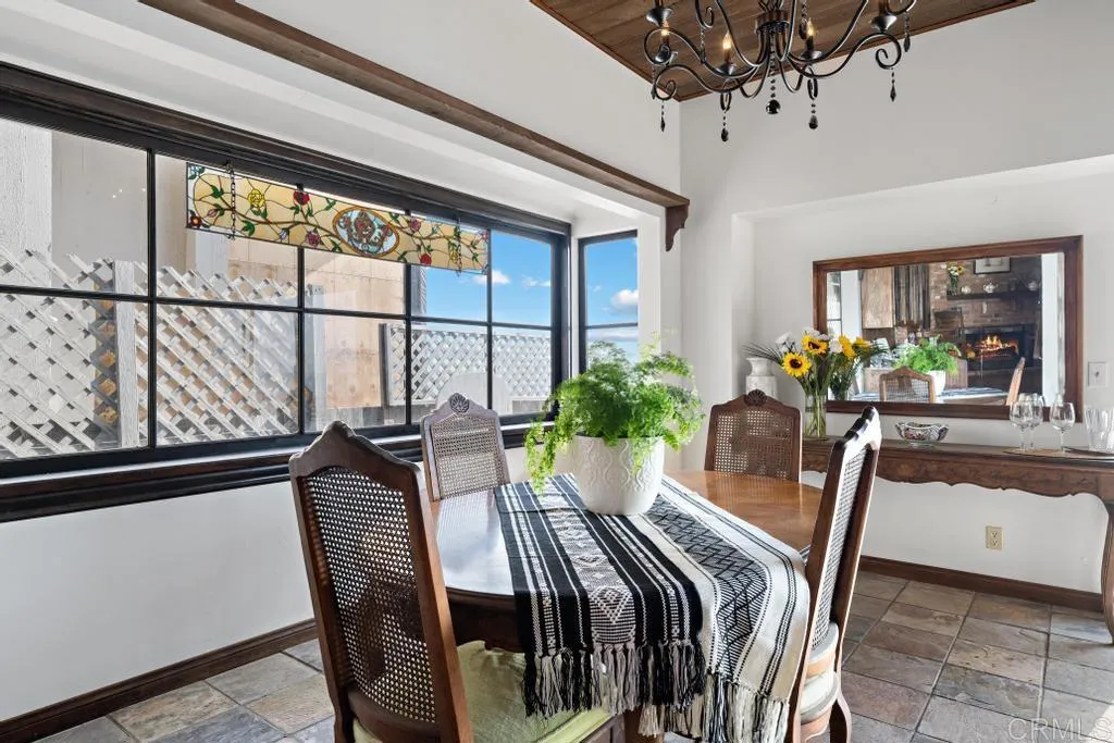 1046 Neptune Avenue Encinitas, CA 92024 - Photo 25 of 49 a view of a dining room with furniture window and wooden floor