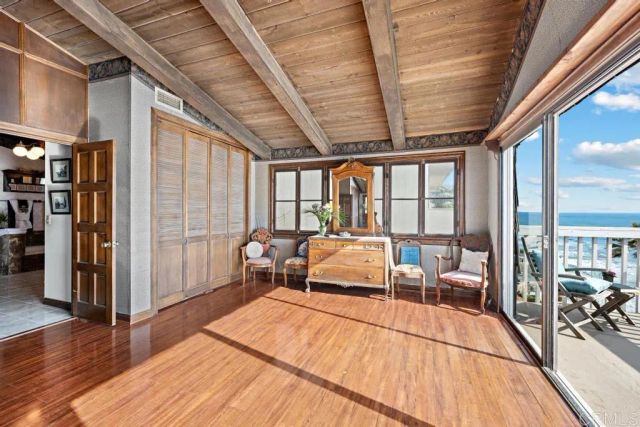 a lobby with furniture and floor to ceiling window