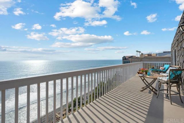 a large spacious bathroom with a double vanity sink a large mirror and a shower