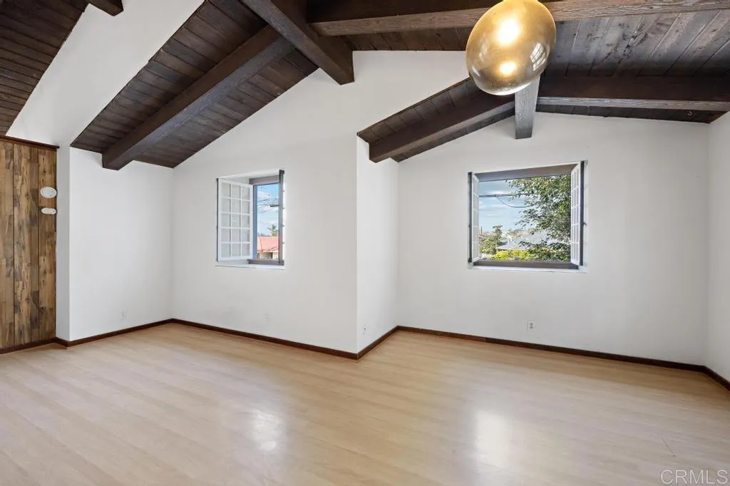 1046 Neptune Avenue Encinitas, CA 92024 - Photo 39 of 49 a view of an empty room with wooden floor