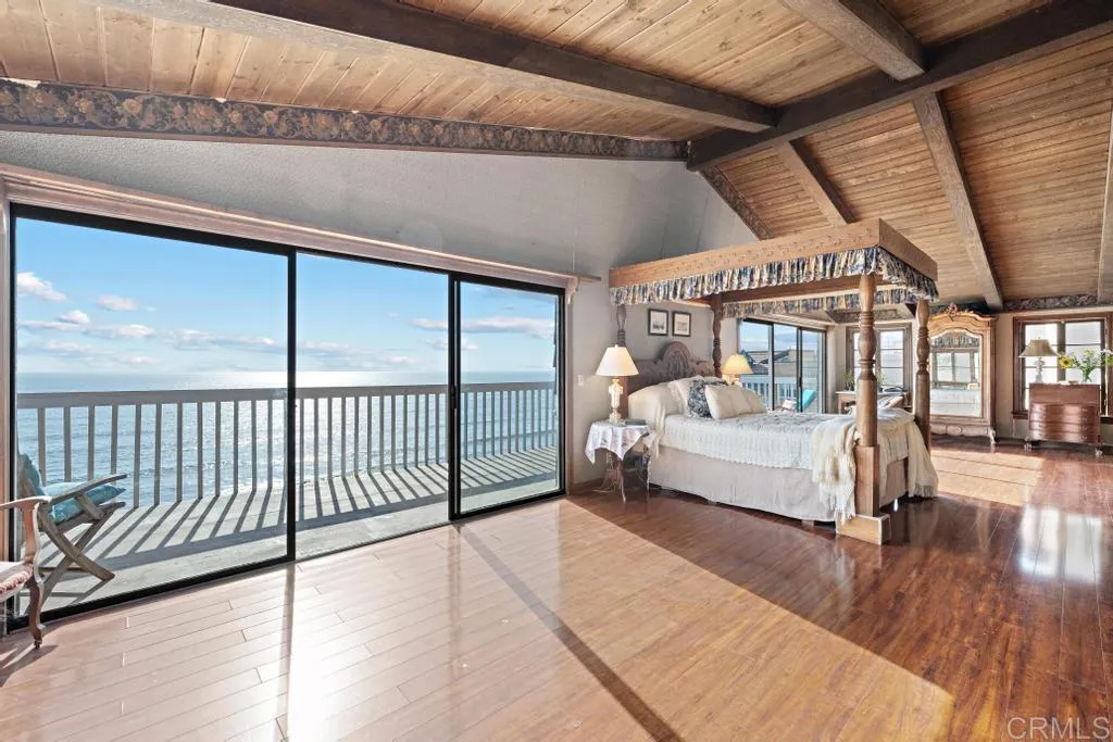 1046 Neptune Avenue Encinitas, CA 92024 - Photo 10 of 49 a bedroom with furniture and a large window