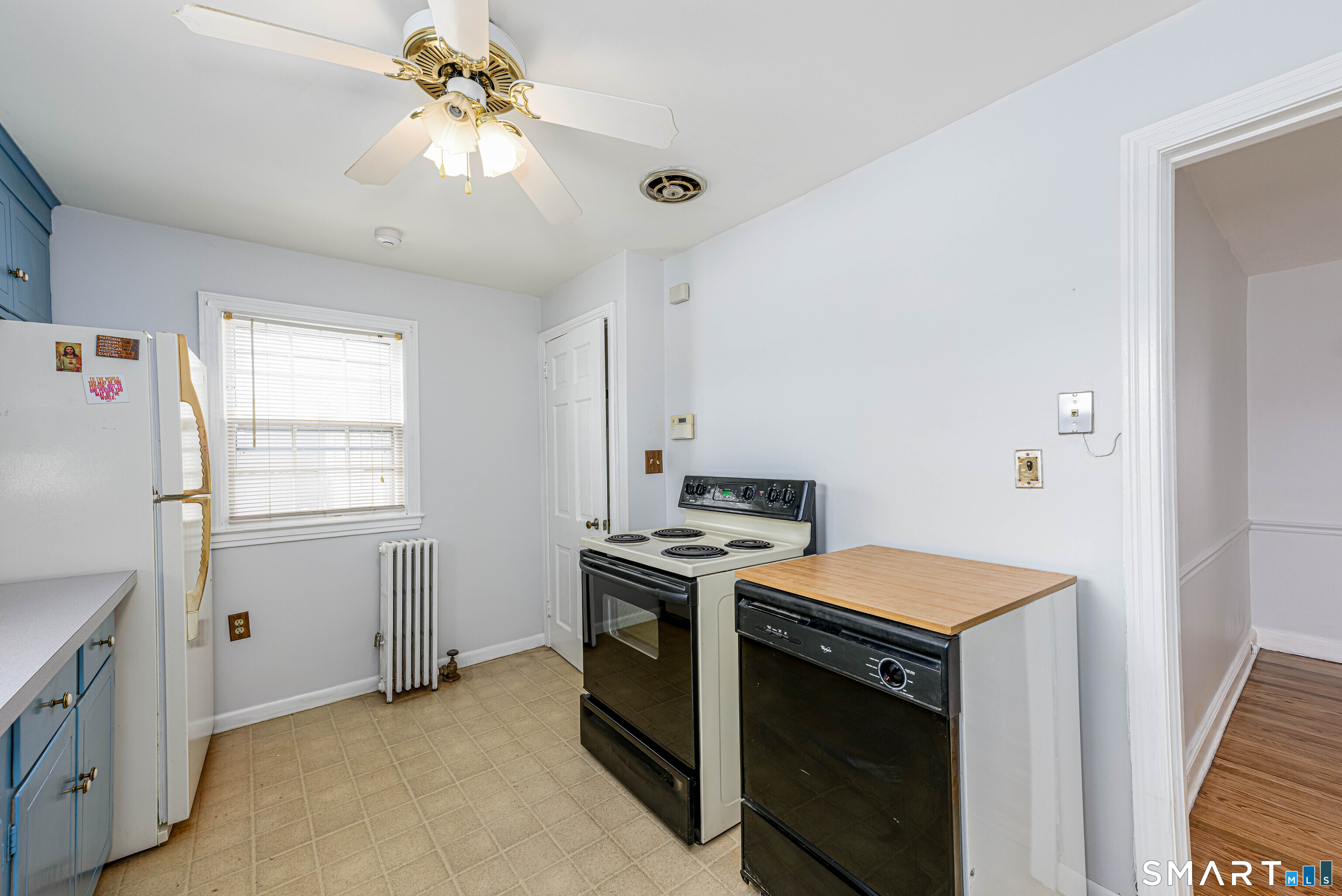 84 Piper Road Hamden, CT 06514 - Photo 11 of 28 a kitchen with a stove a sink and a refrigerator
