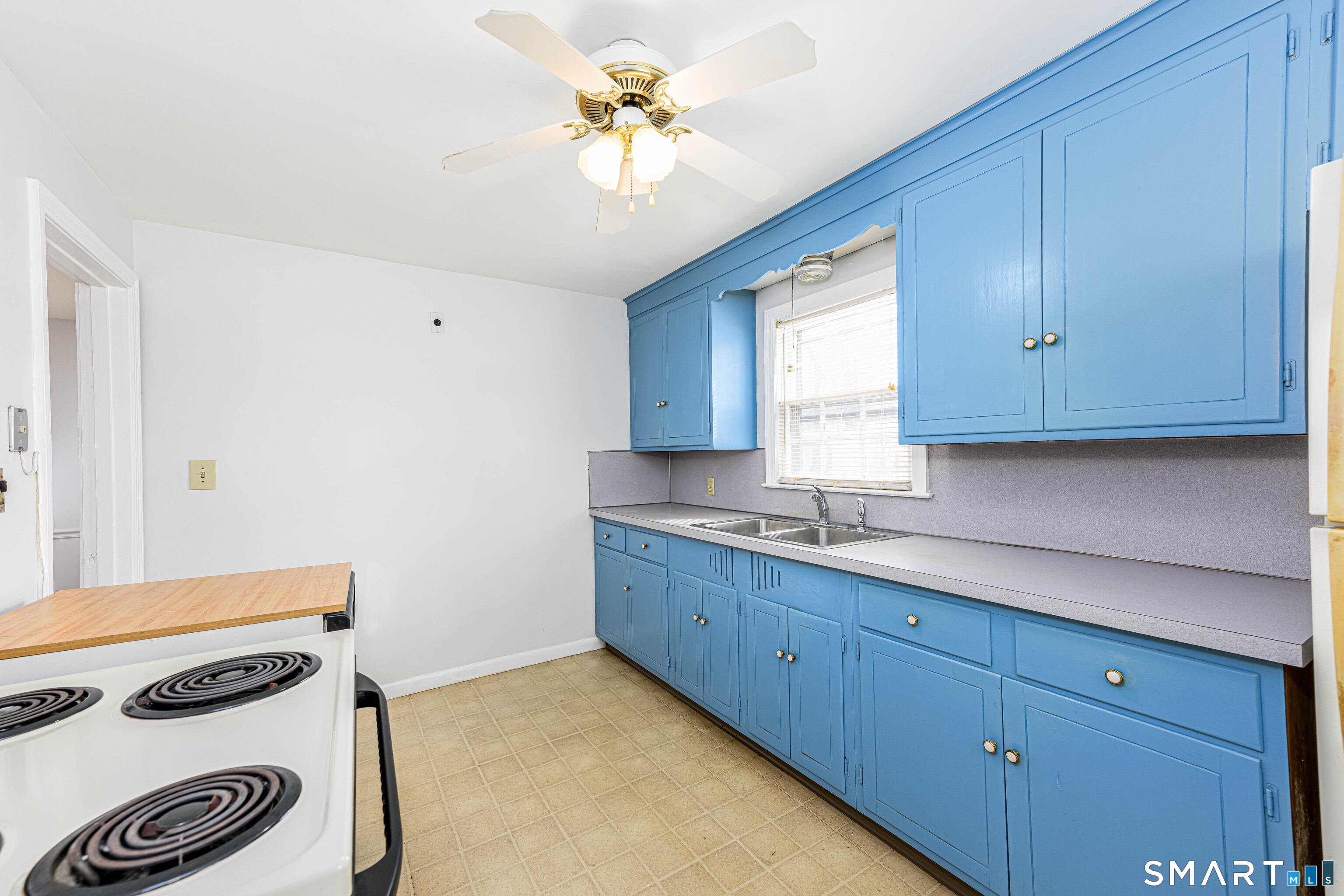 84 Piper Road Hamden, CT 06514 - Photo 12 of 28 a kitchen with a sink a stove and cabinets