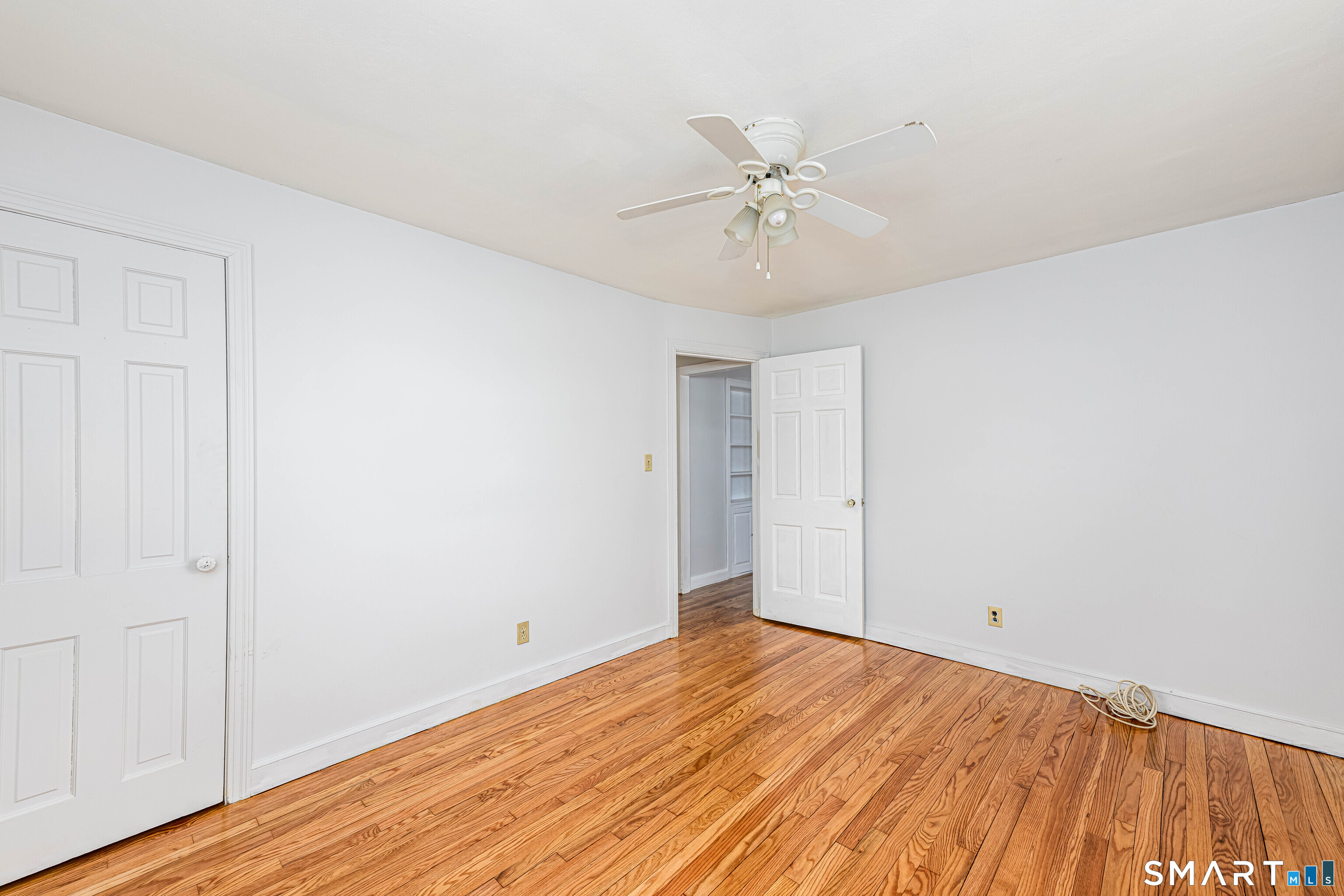84 Piper Road Hamden, CT 06514 - Photo 15 of 28 a view of a room with wooden floor and closet