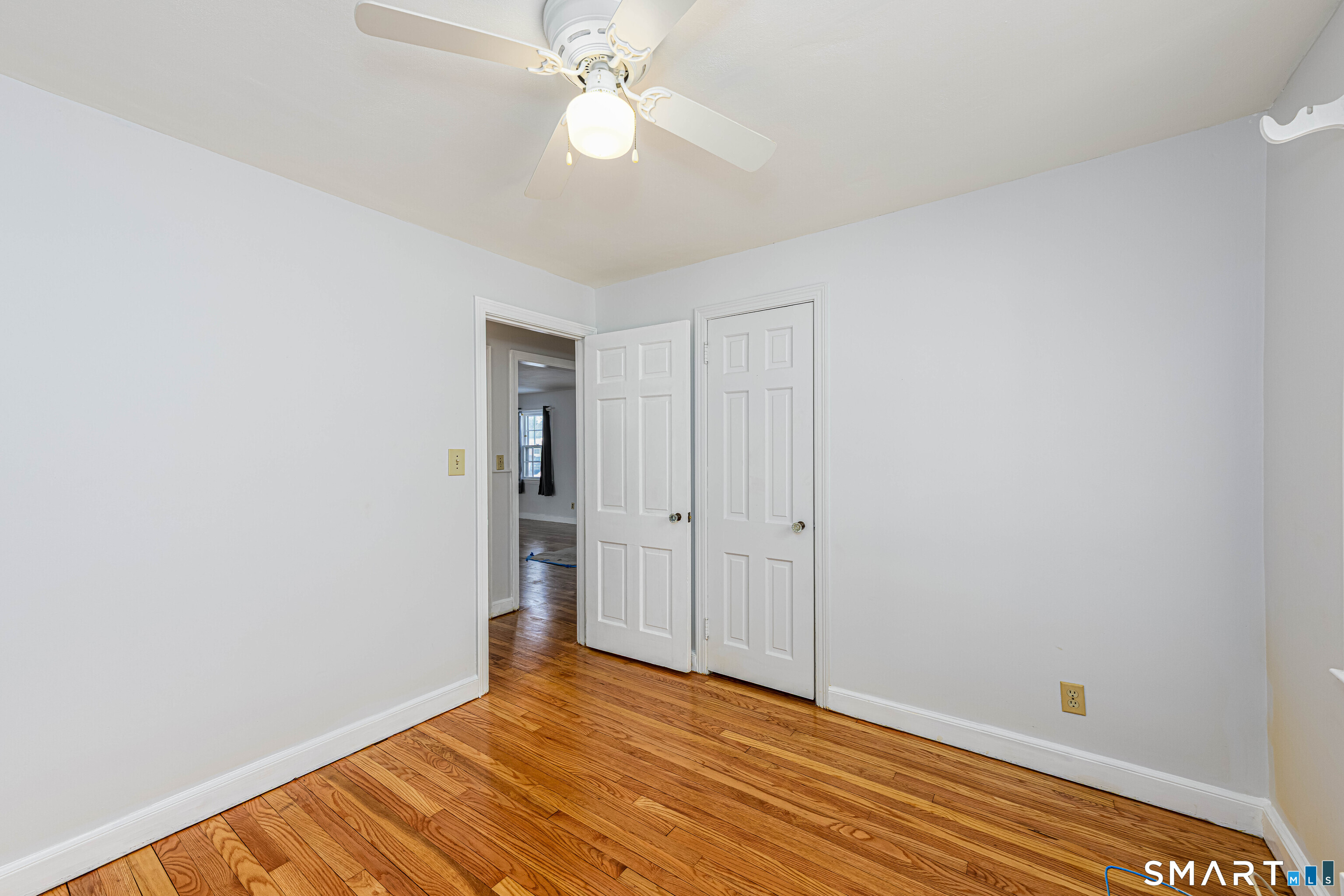84 Piper Road Hamden, CT 06514 - Photo 20 of 28 a view of an empty room with wooden floor