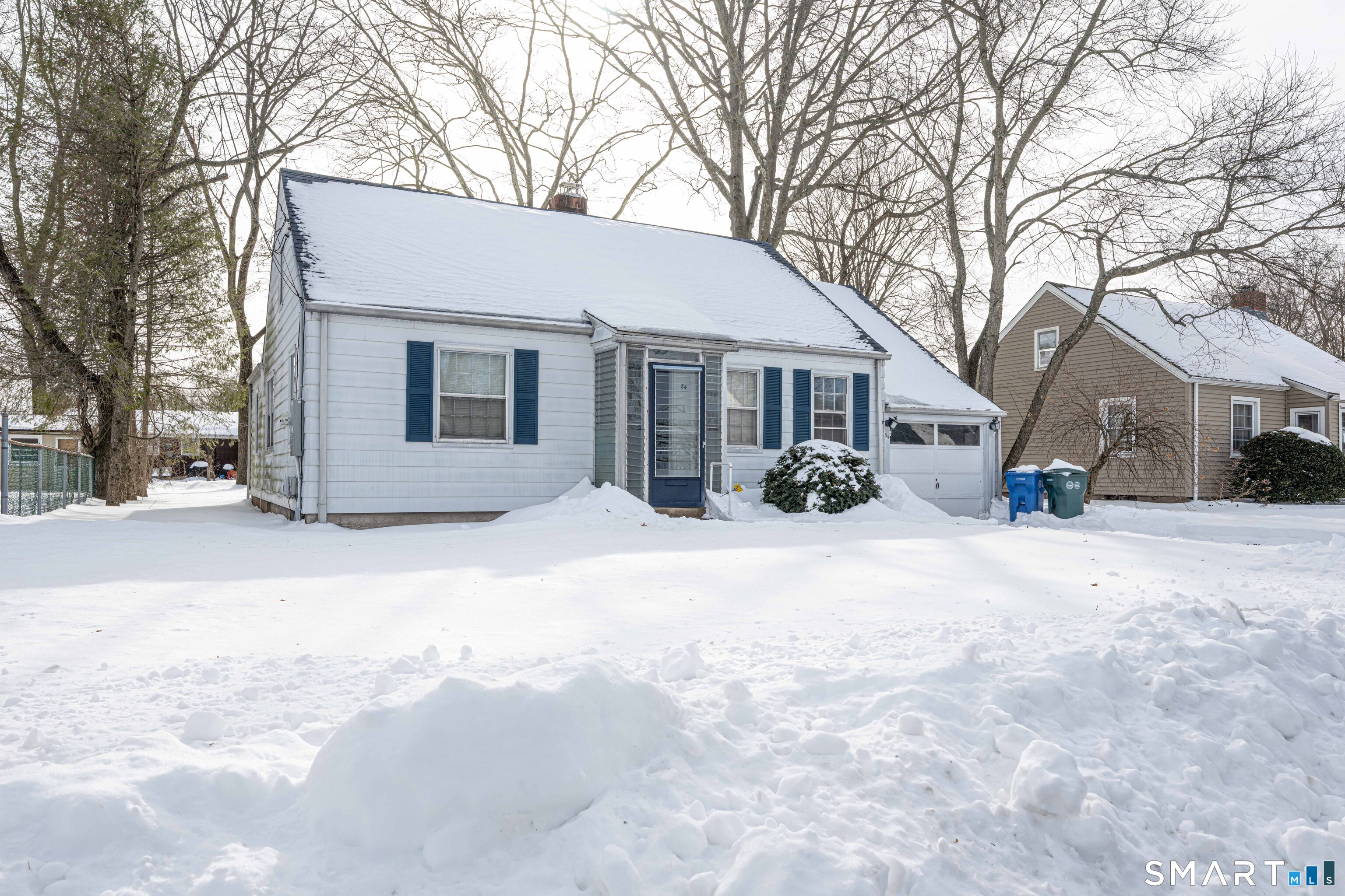 84 Piper Road Hamden, CT 06514 - Photo 2 of 28 a view of house with a yard covered in snow