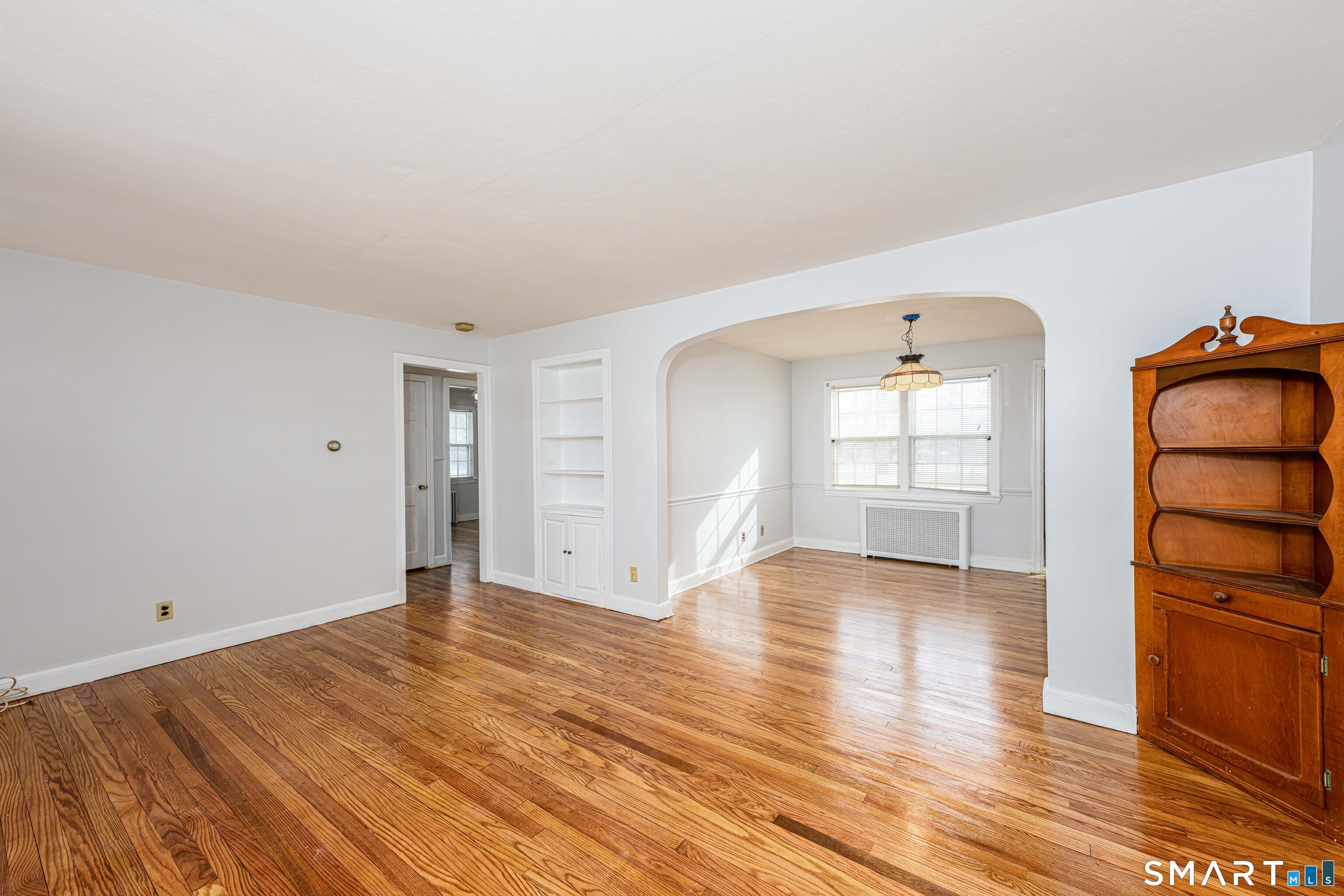 84 Piper Road Hamden, CT 06514 - Photo 6 of 28 a view of empty room with wooden floor and window