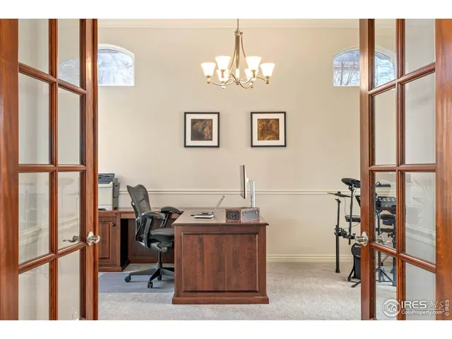 a workspace with furniture and a window