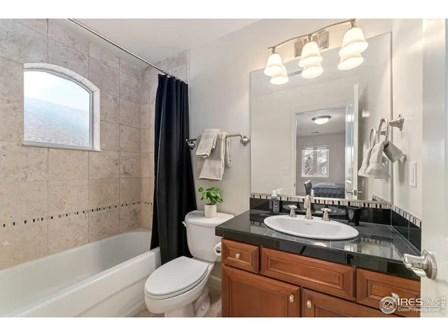 a bathroom with a sink a toilet and bathtub