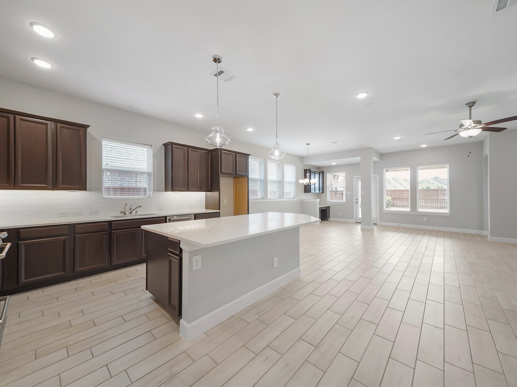 6919 Myrtle Drive Katy, TX 77493 - Photo 13 of 38 a large kitchen with stainless steel appliances granite countertop a large counter top a stove a sink and a refrigerator