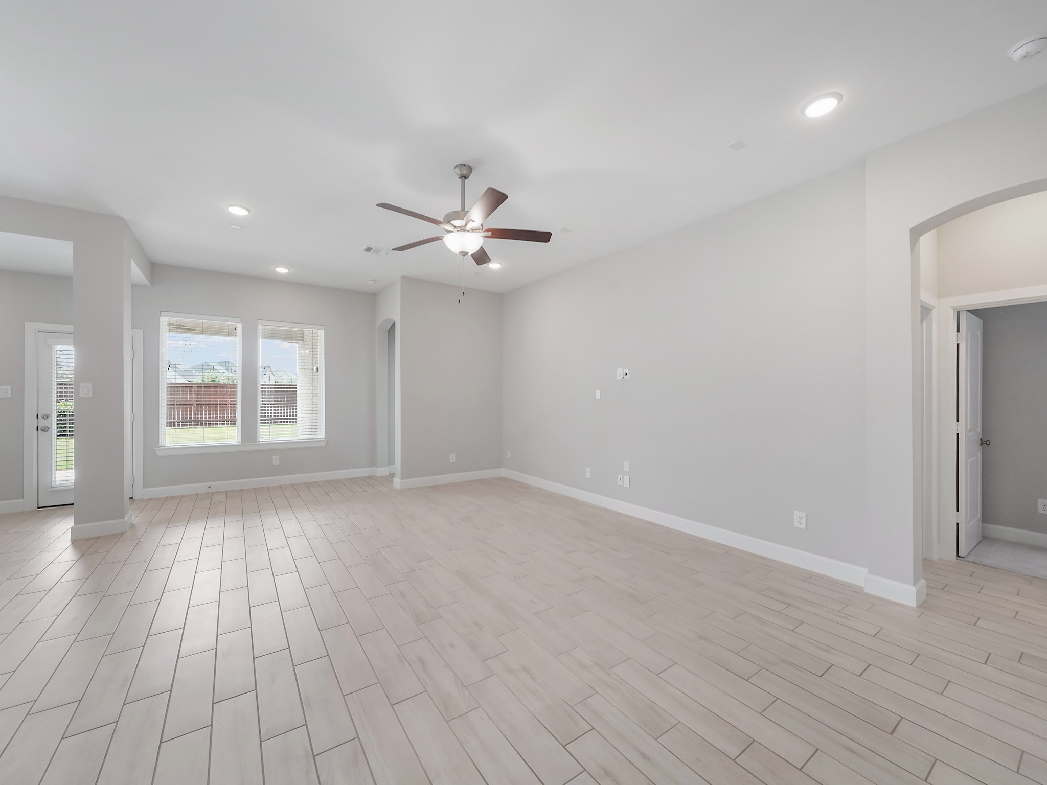 6919 Myrtle Drive Katy, TX 77493 - Photo 17 of 38 wooden floor in an empty room with a window