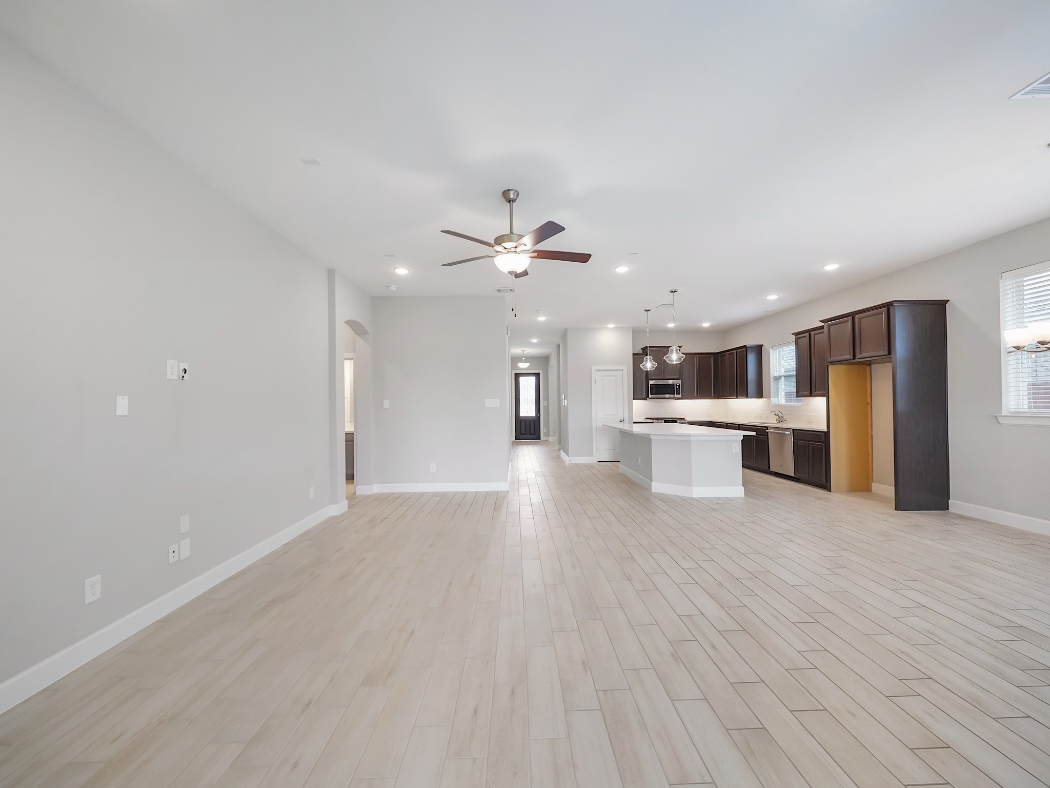 6919 Myrtle Drive Katy, TX 77493 - Photo 38 of 38 a view of a kitchen with a sink cabinets and wooden floor
