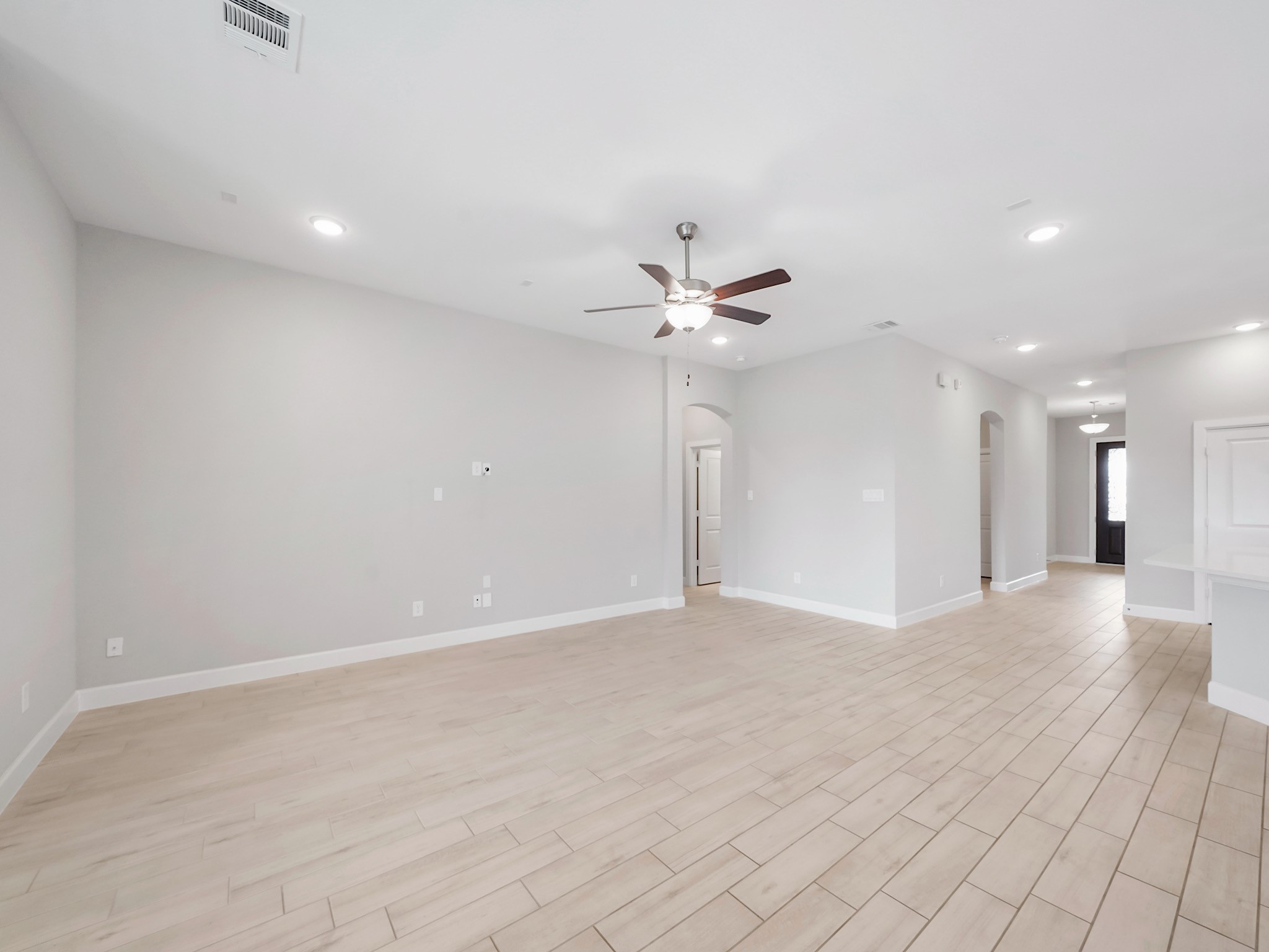 6919 Myrtle Drive Katy, TX 77493 - Photo 18 of 38 a view of a livingroom with a ceiling fan and window
