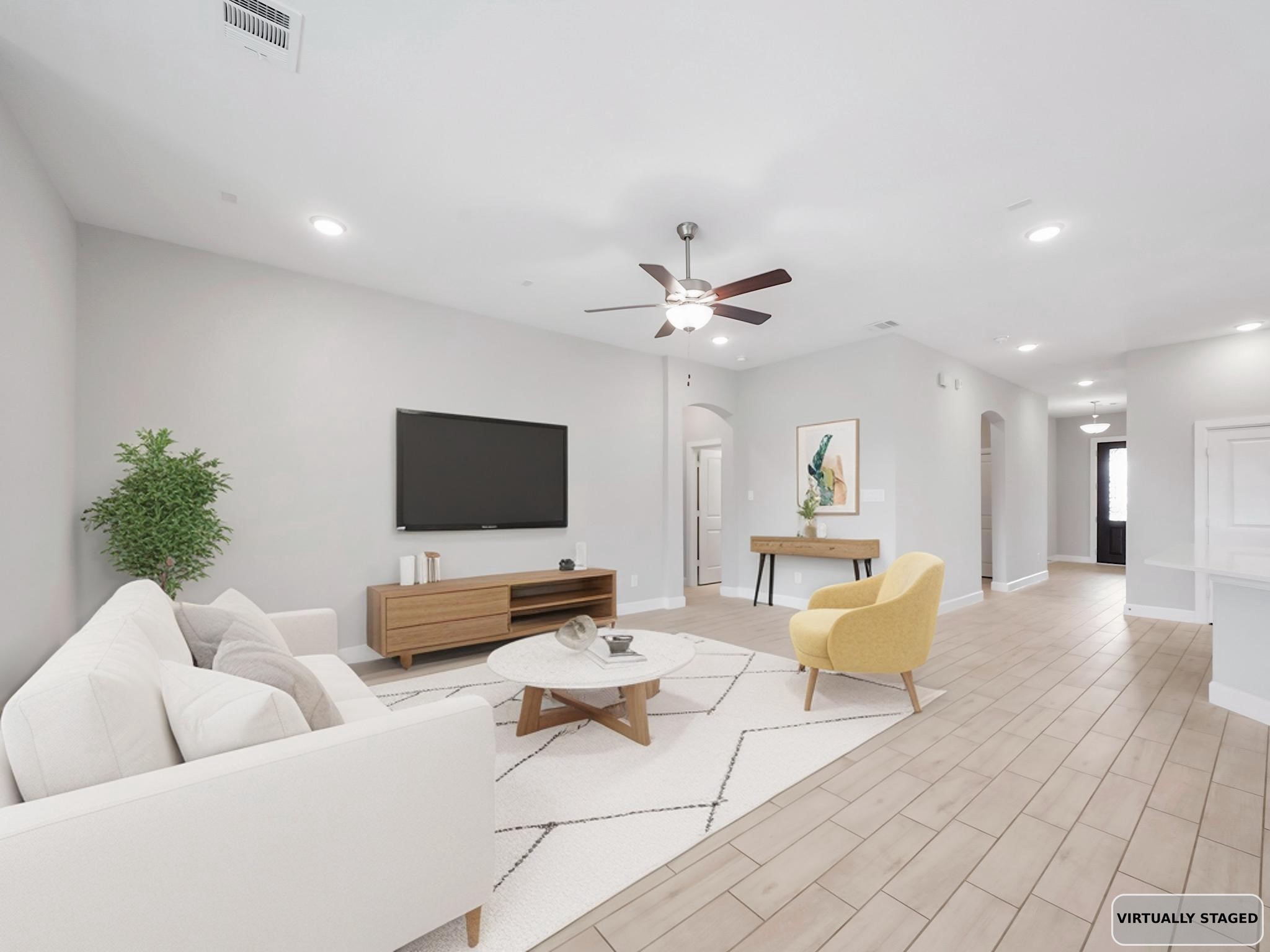 6919 Myrtle Drive Katy, TX 77493 - Photo 19 of 38 a living room with furniture and a flat screen tv