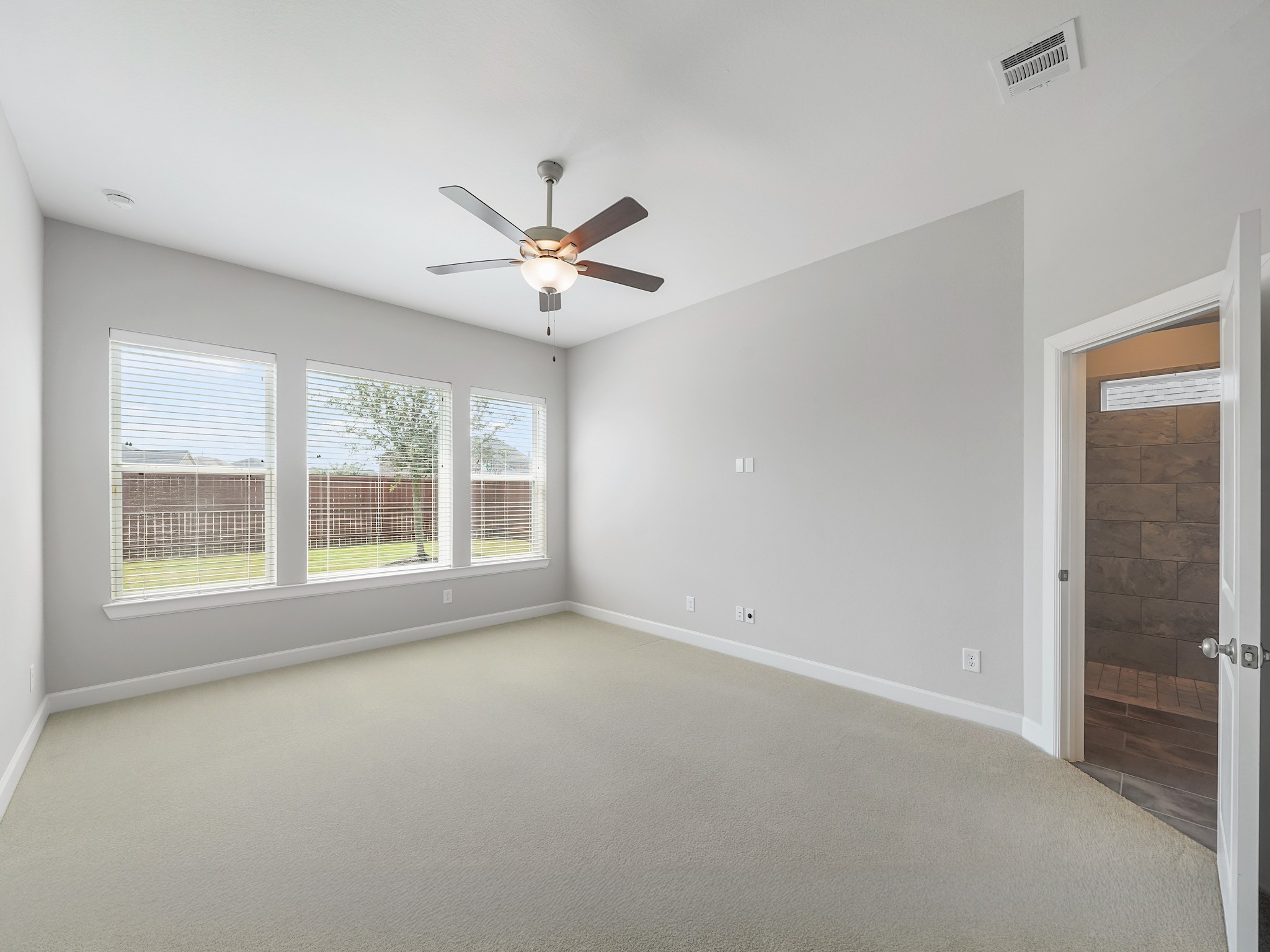 6919 Myrtle Drive Katy, TX 77493 - Photo 20 of 38 a view of an empty room with a window