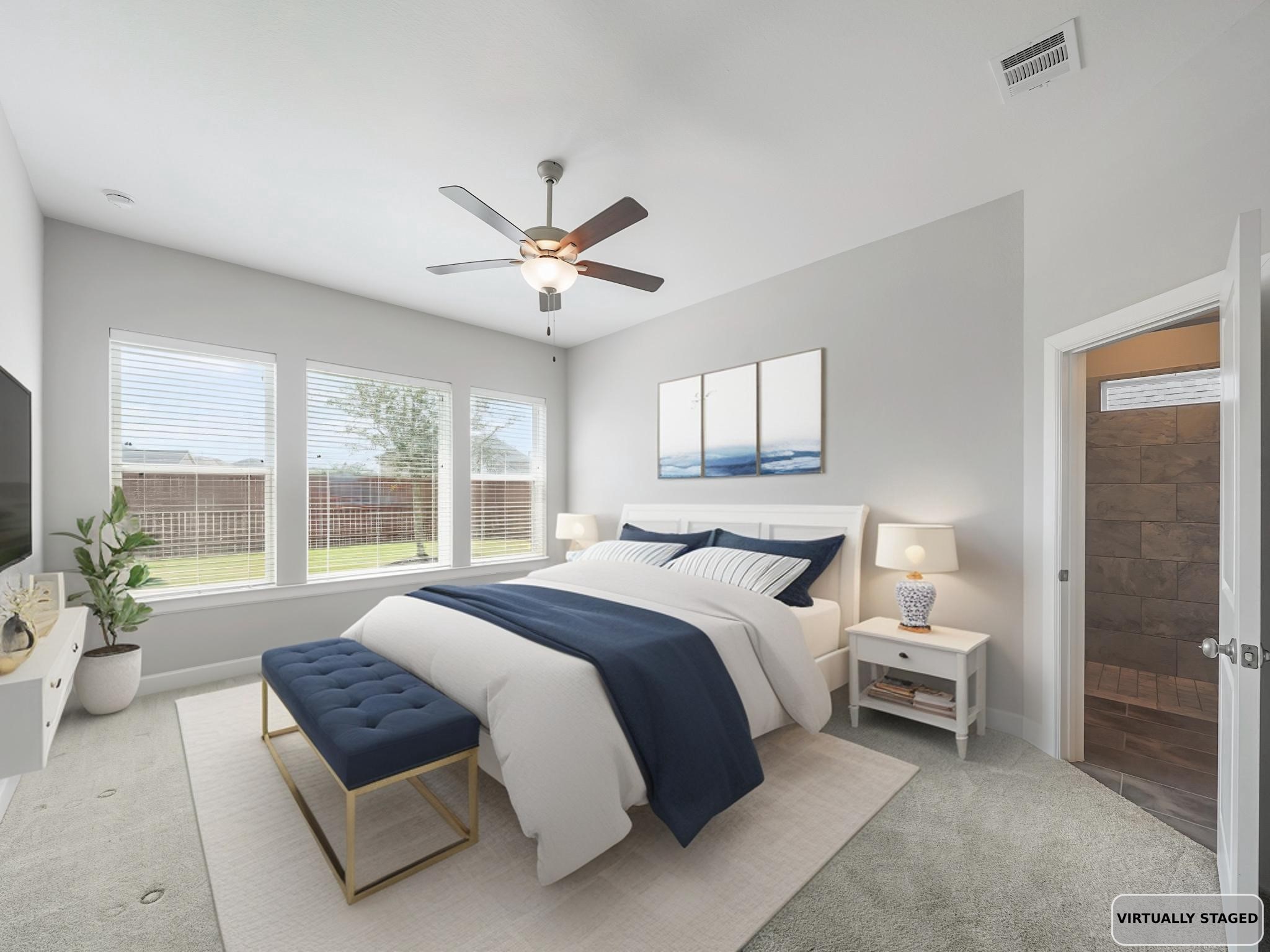 6919 Myrtle Drive Katy, TX 77493 - Photo 21 of 38 a spacious bedroom with a large bed and a chandelier