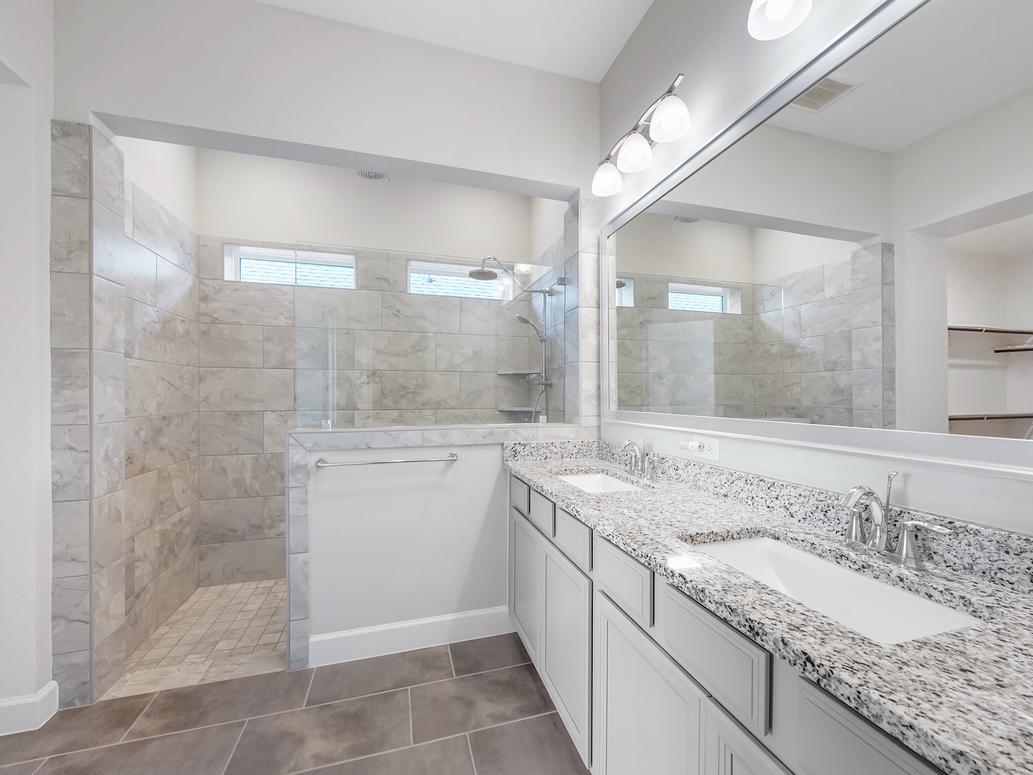 6919 Myrtle Drive Katy, TX 77493 - Photo 24 of 38 a bathroom with a granite countertop sink a toilet and shower