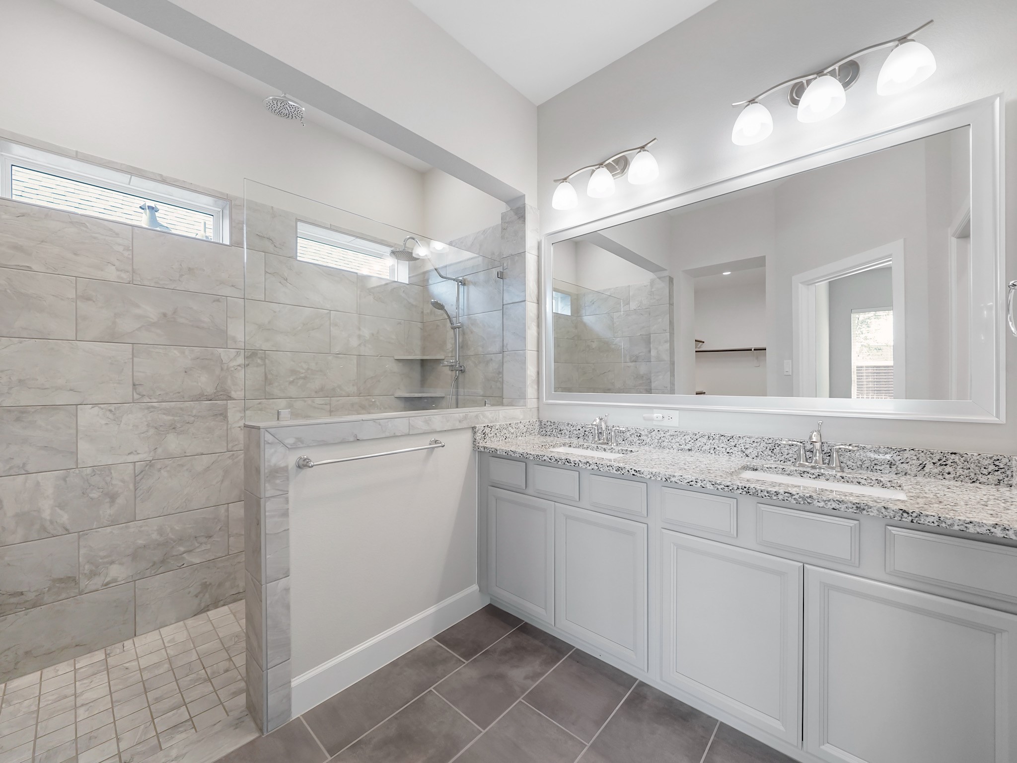 6919 Myrtle Drive Katy, TX 77493 - Photo 25 of 38 a bathroom with a granite countertop sink mirror and double